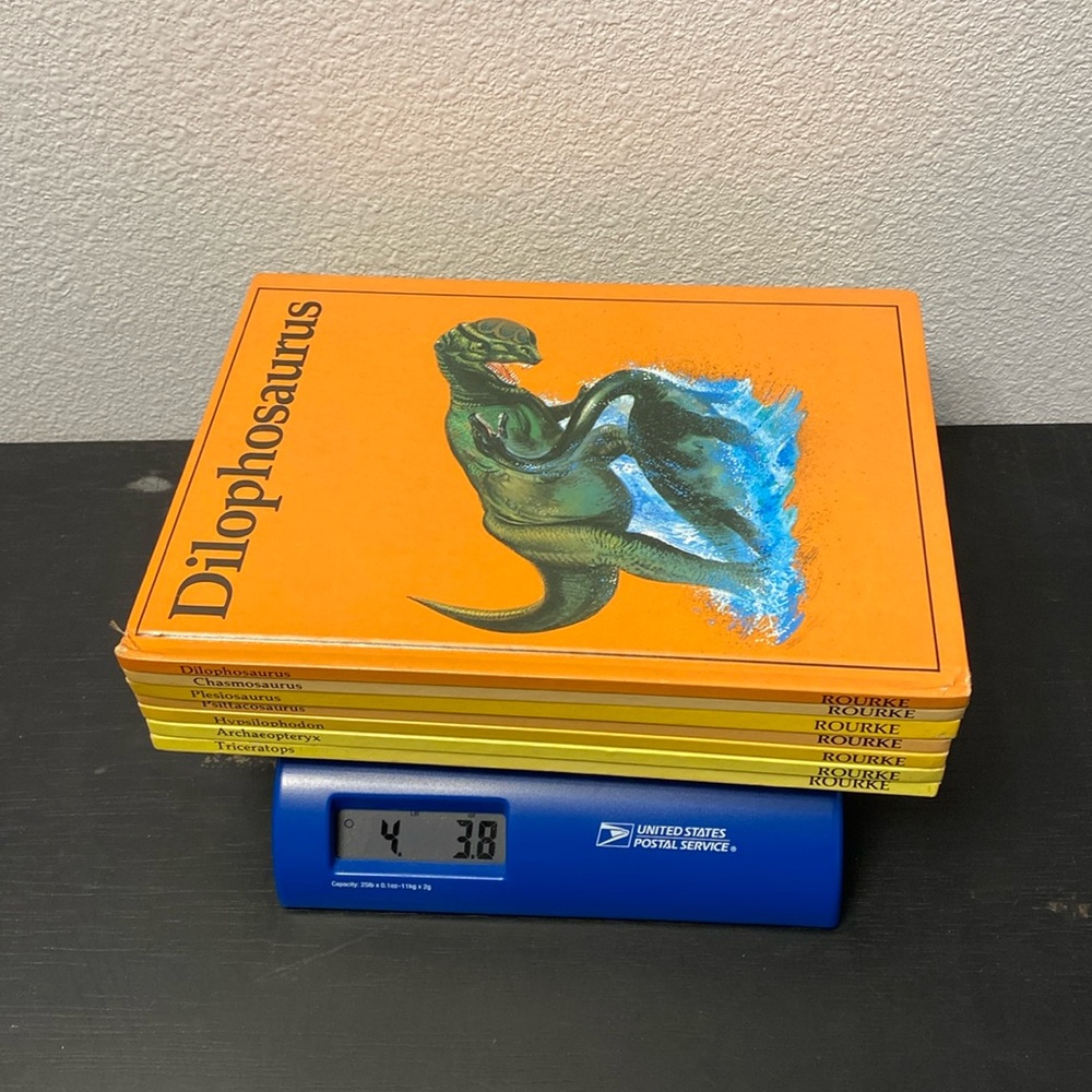 Vintage Rourke Dinosaur Library 7 Books Yellow Orange Peach Decorative Bookshelf